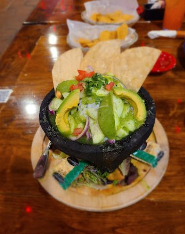 Colorful Mexican restaurant dining room with patio seating.